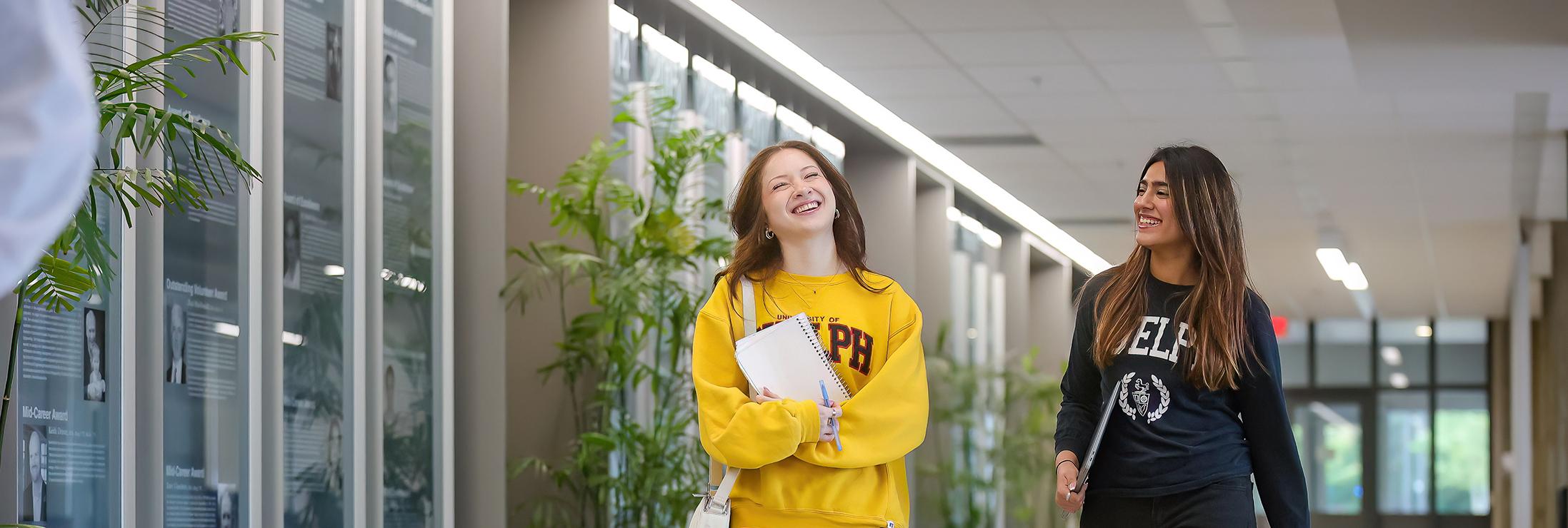 2 students walking down the hall
