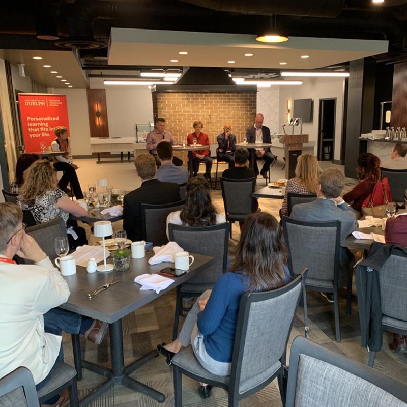 Panelists and participants at the Evolve Guelph breakfast panel.