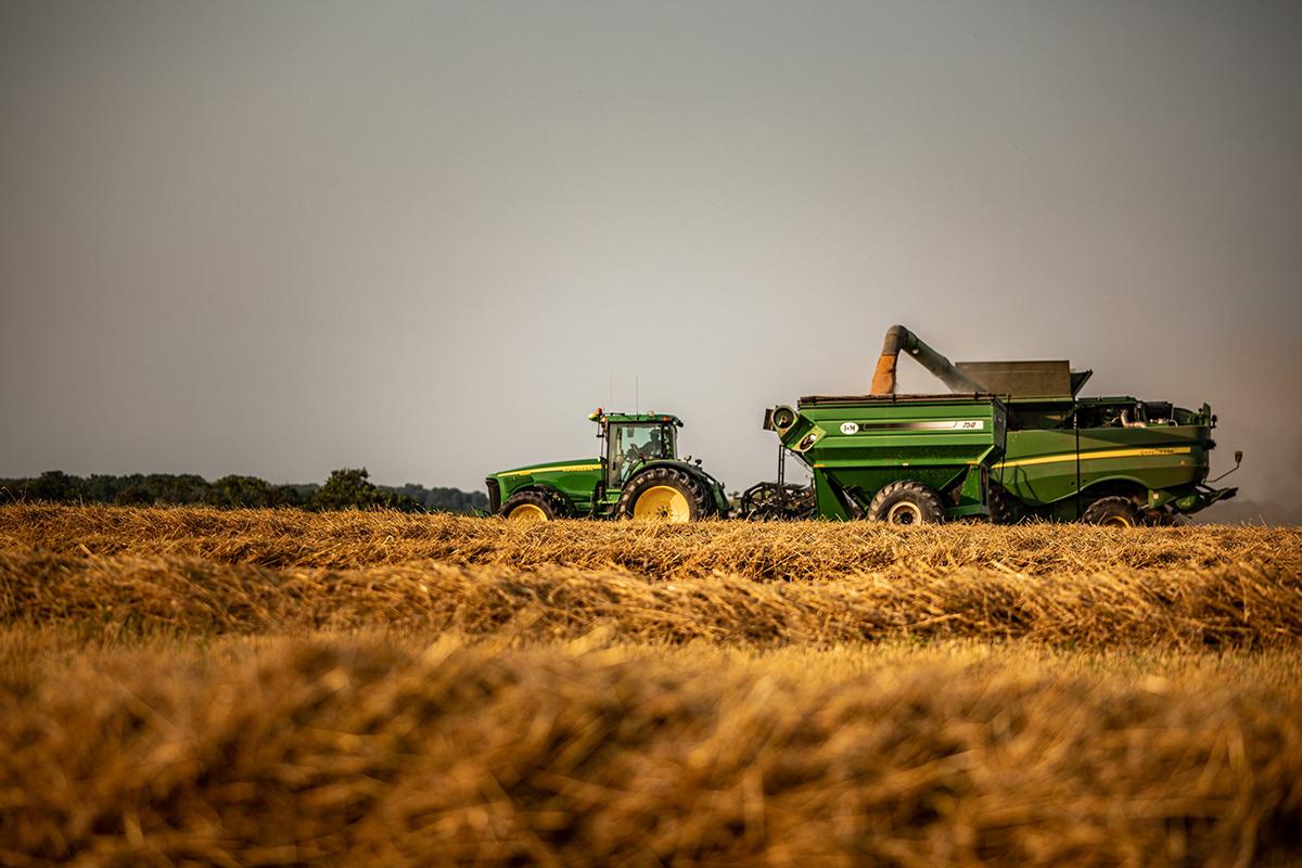 Green tractors in a field