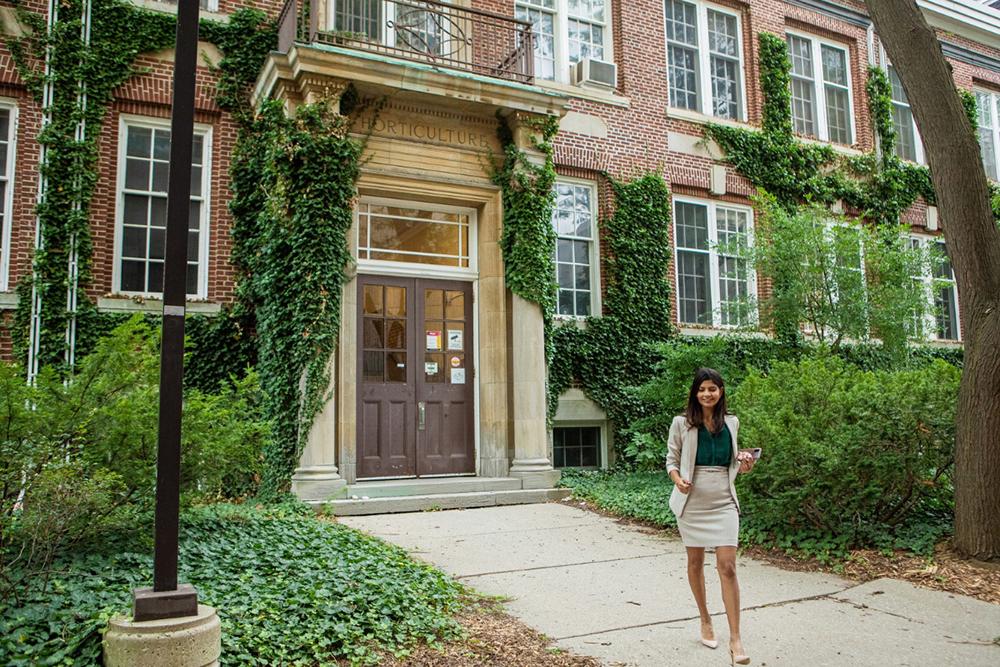 Business woman walking outside of building