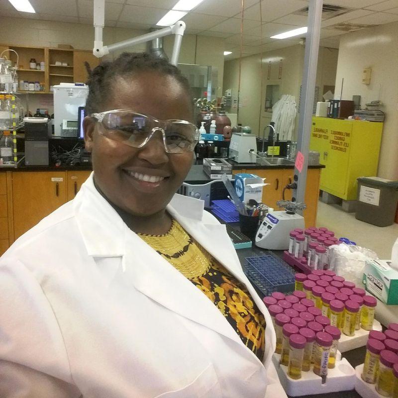 Master's student Beatrice Gedion working in the lab.
