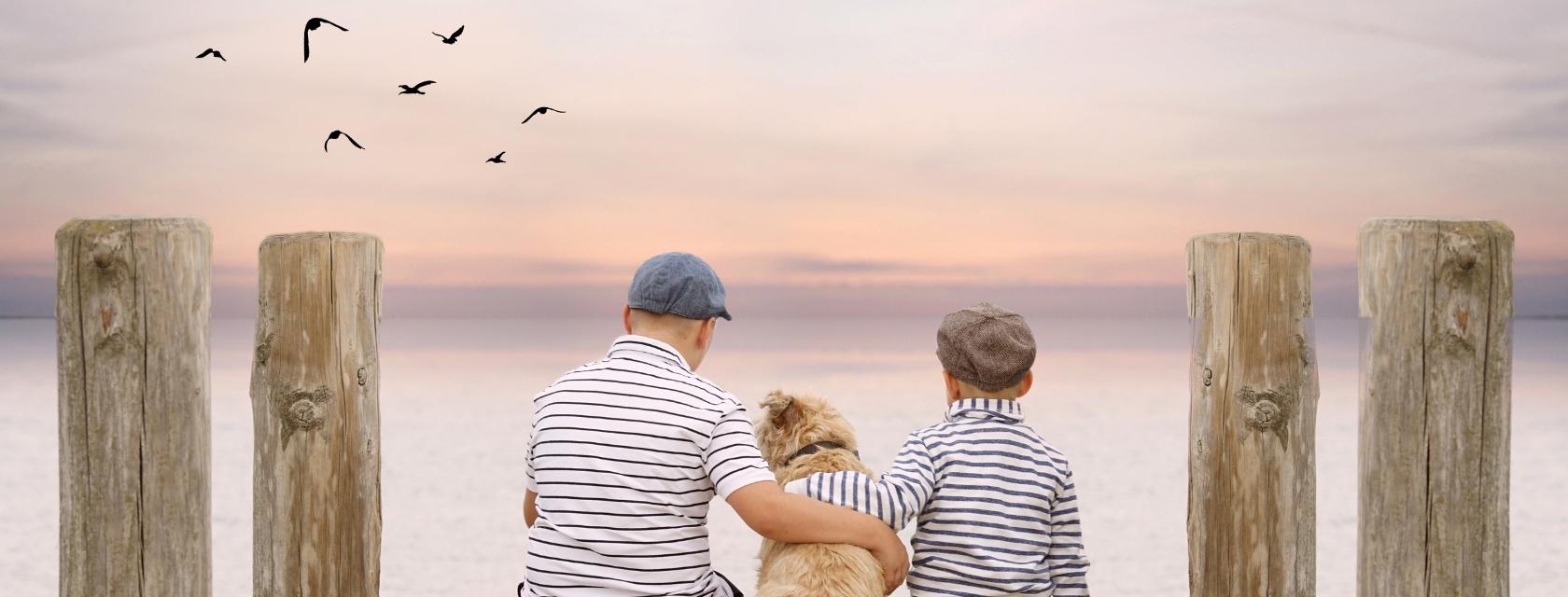 people and dog on a dock