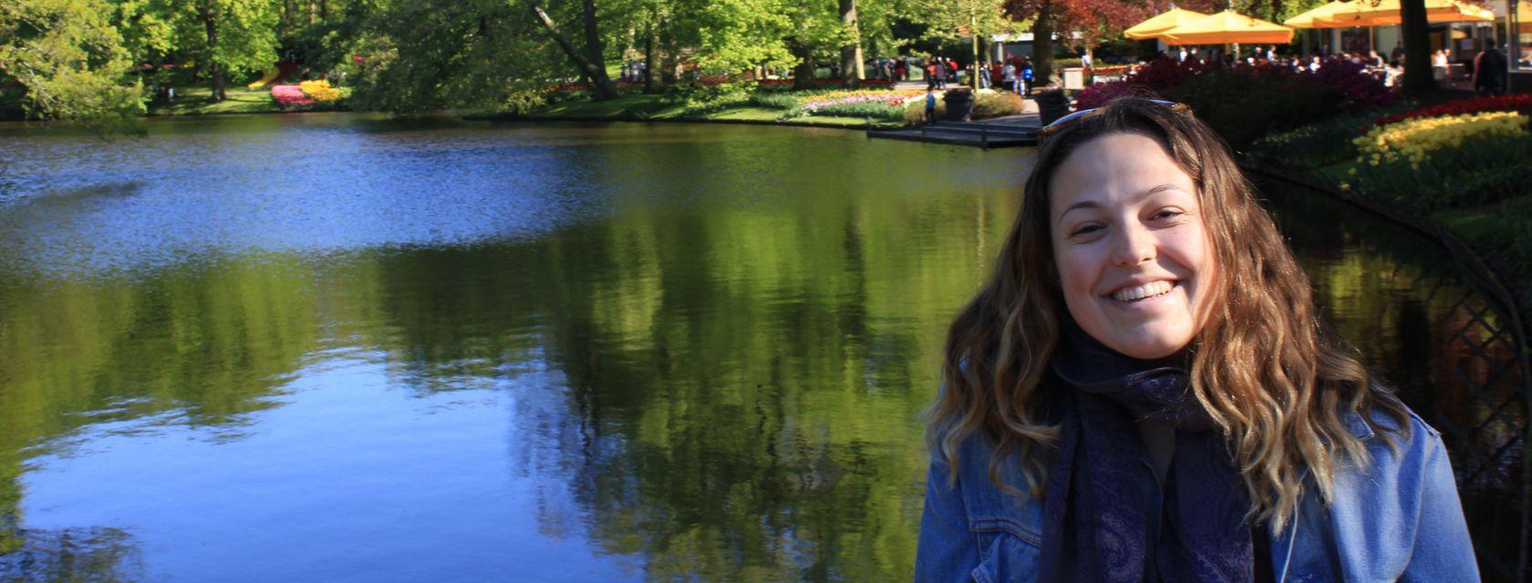 U of G Grad Johannah Brockie poses near a pond.