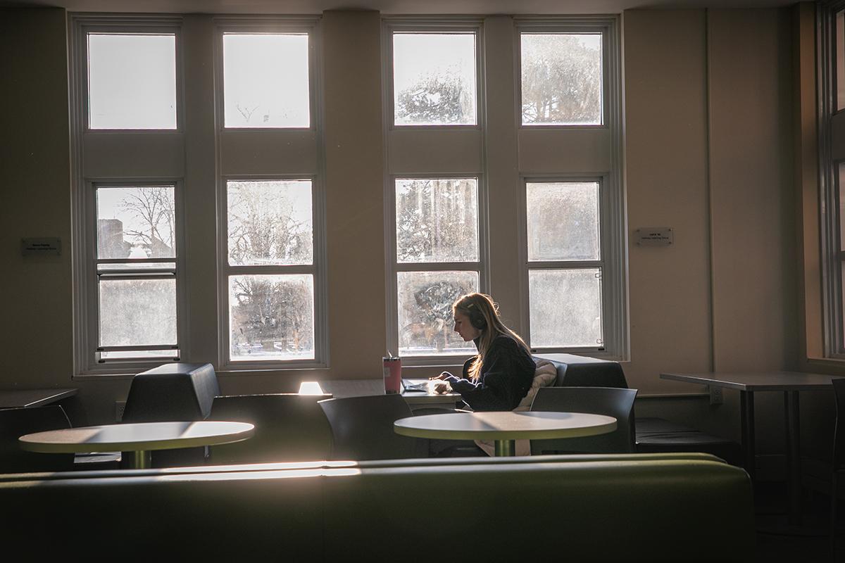 Woman studying in an empty room