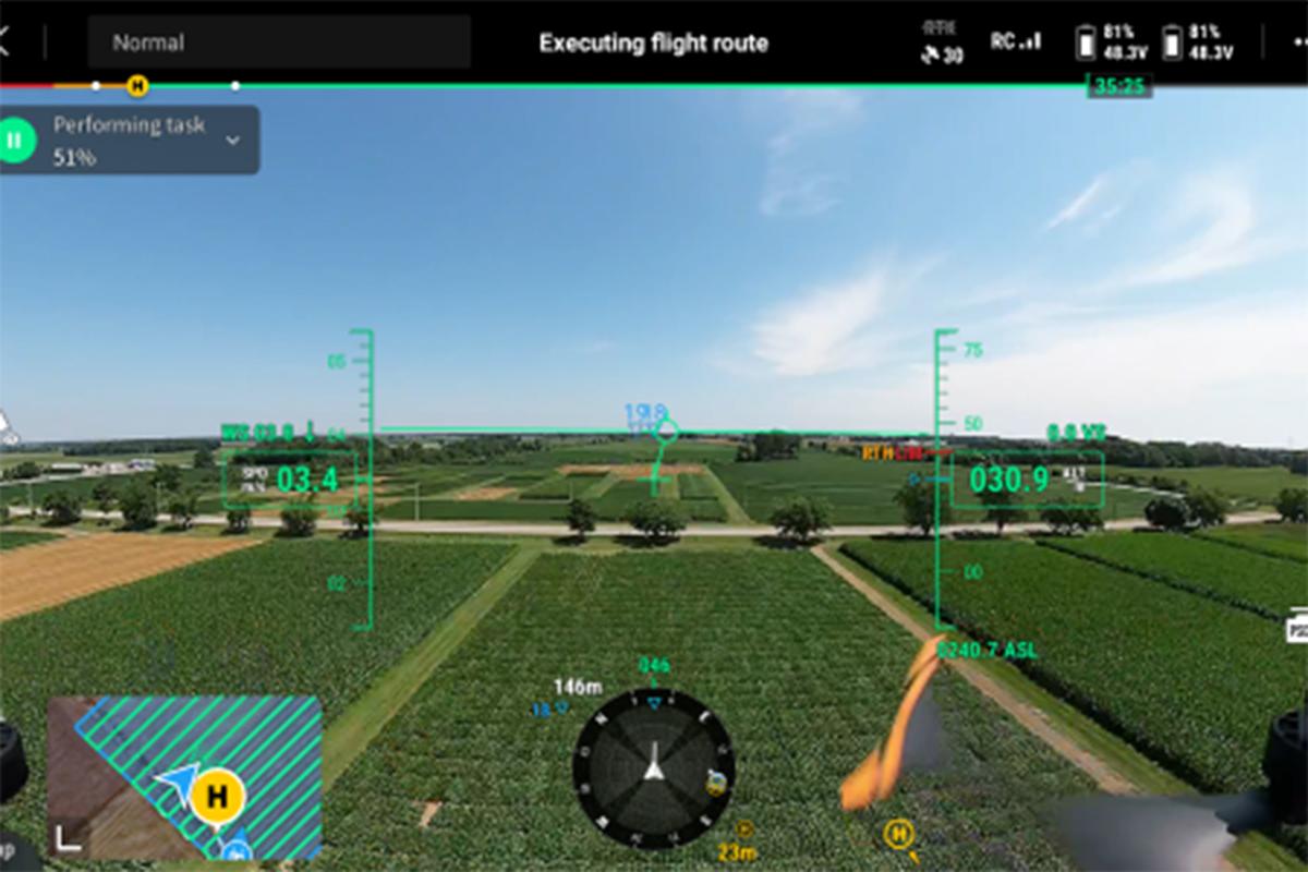A view from the screen of the drone, showing a field and data.