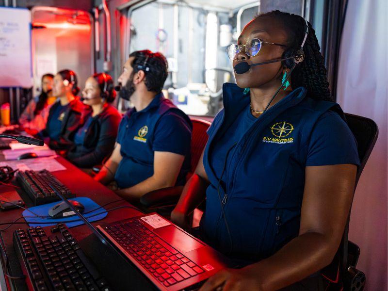 Moronke Harris sitting in the command centre of a deep sea dive. 