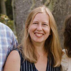 Cathryn Spence, blonde hair, smiling at the camera