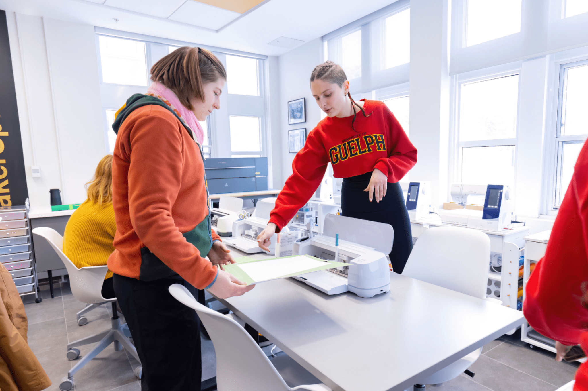 two students using Cricut machine
