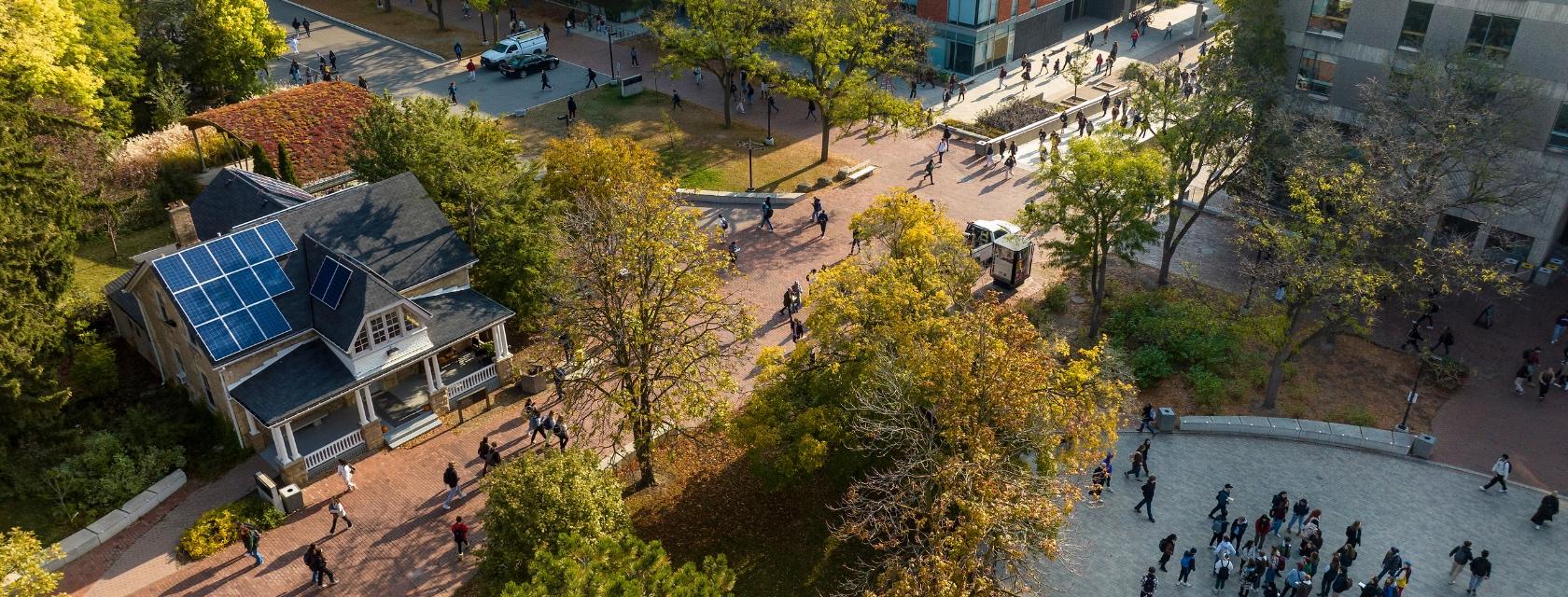 Branion Plaza in the fall with students walking
