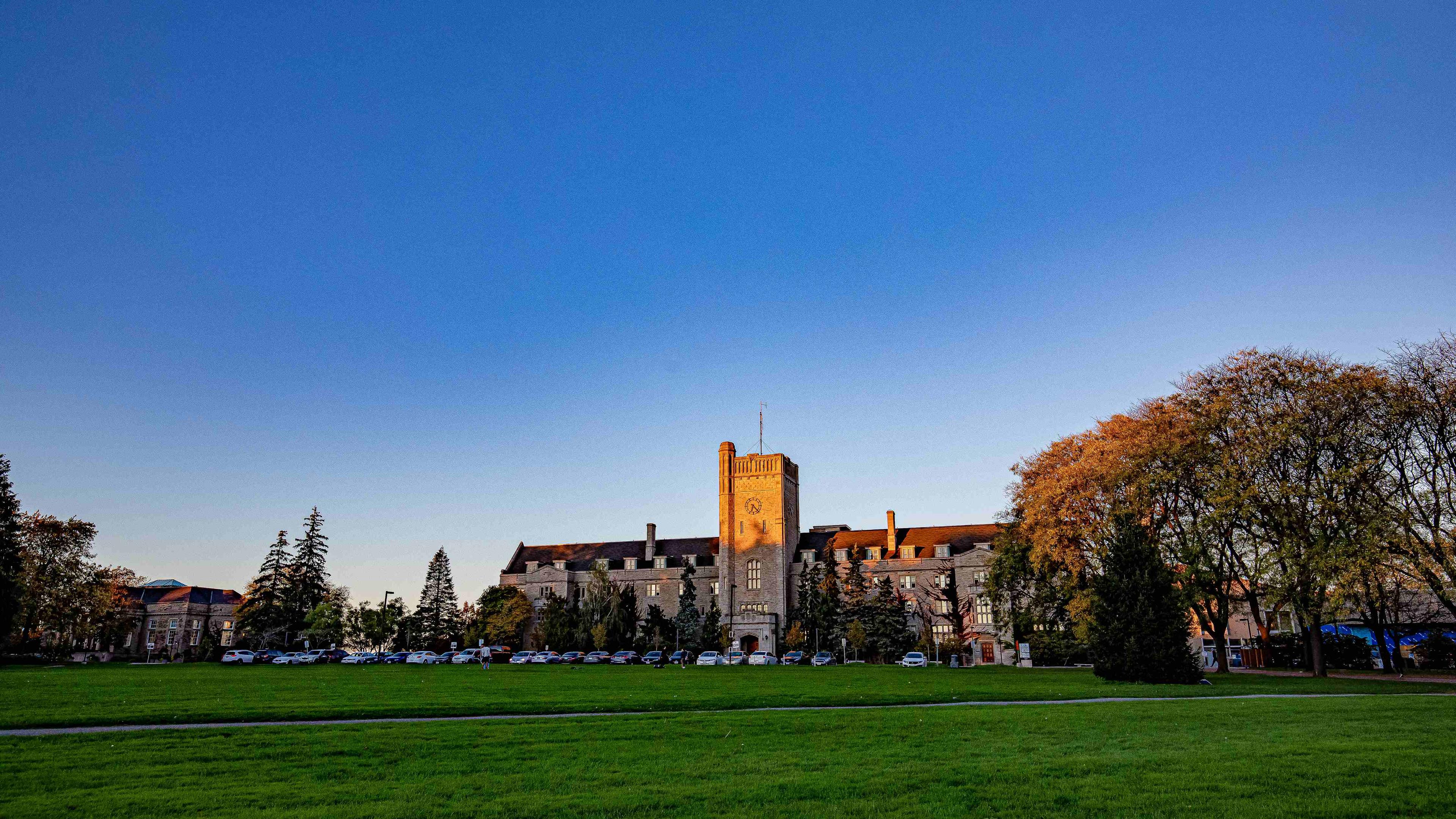 Field of Johnston Green and front view of Johnston Hall
