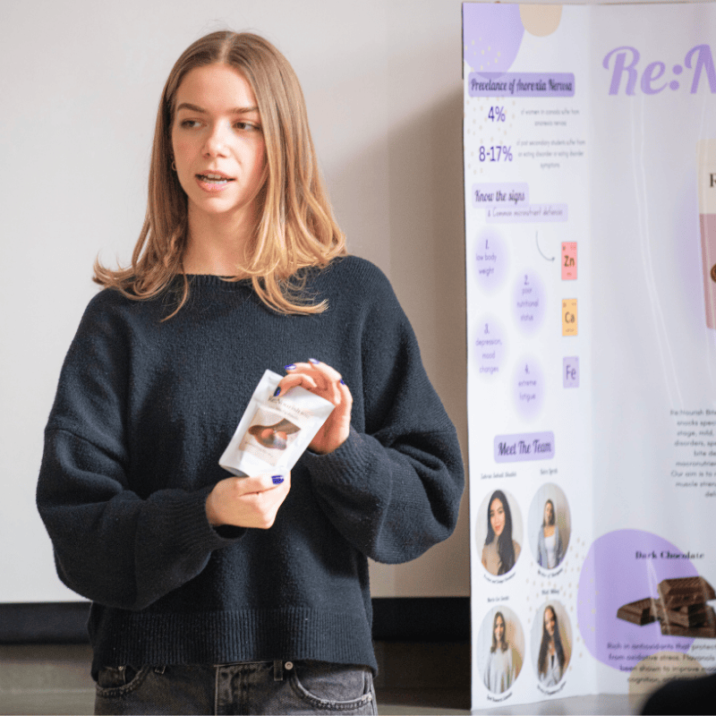 Student presenting her food product