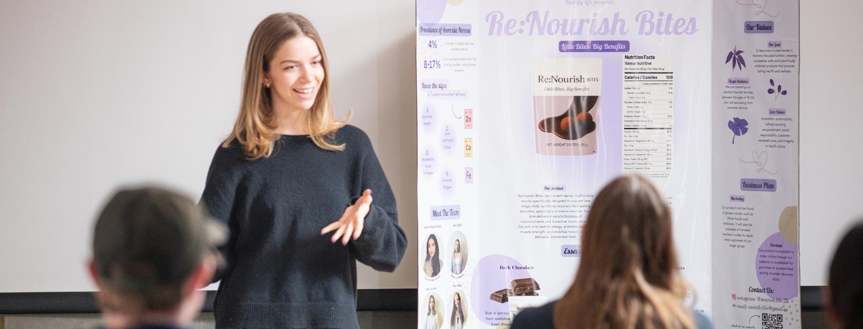 Student presenting a poster