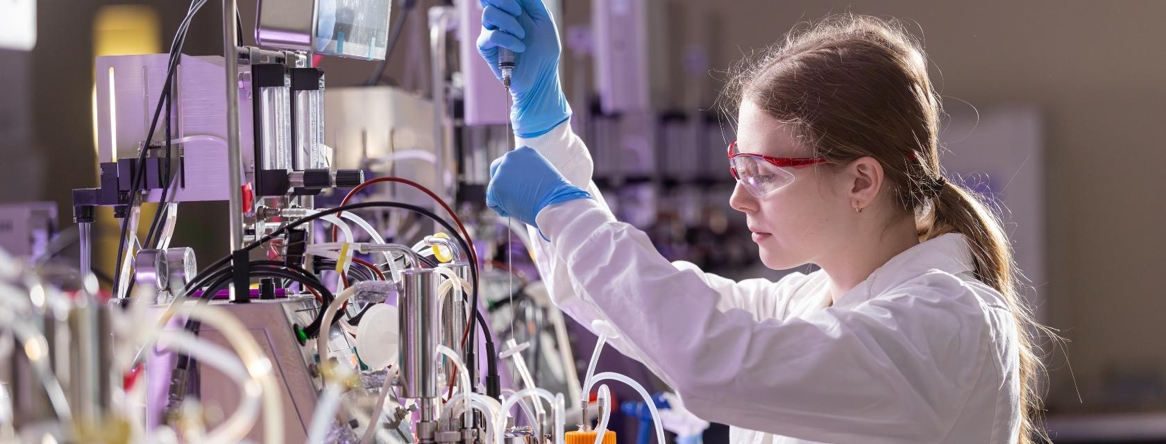 Researchers taking sample from Robogut Lab