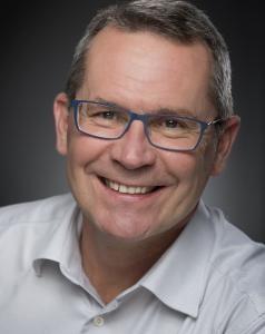 Dr. Istvan Rajcan looking into the camera and smiling