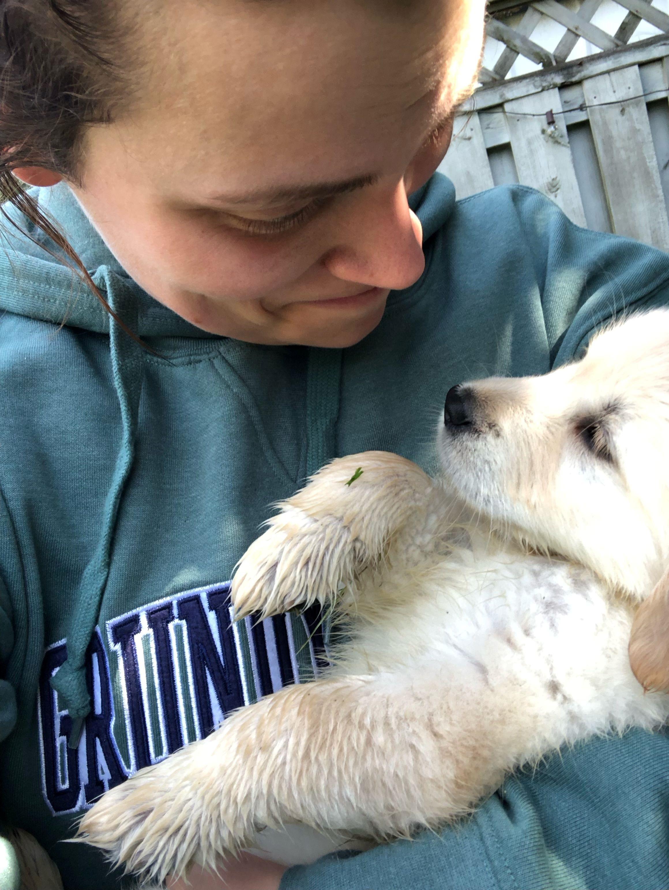 Mikaela and her golden retriever puppy 