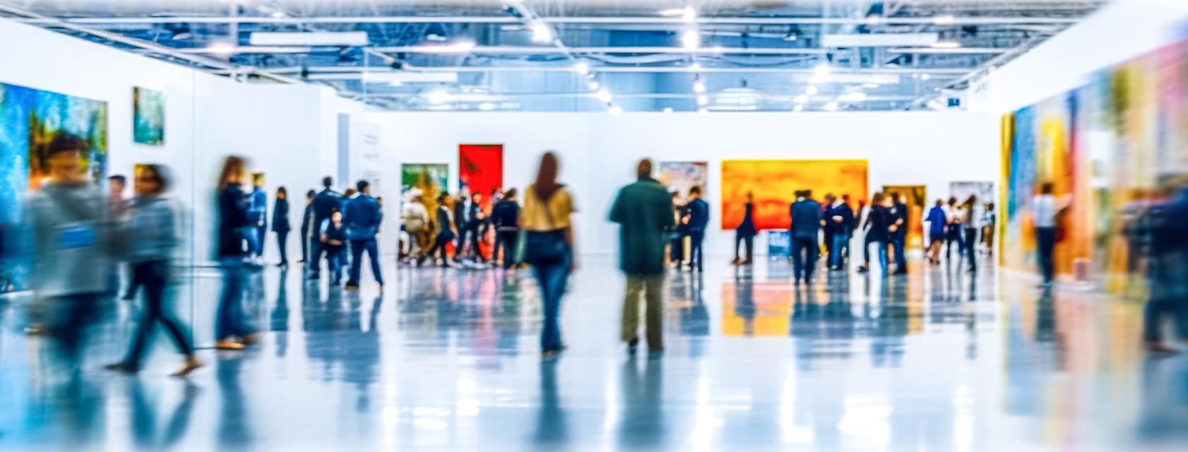 People walk around an art gallery