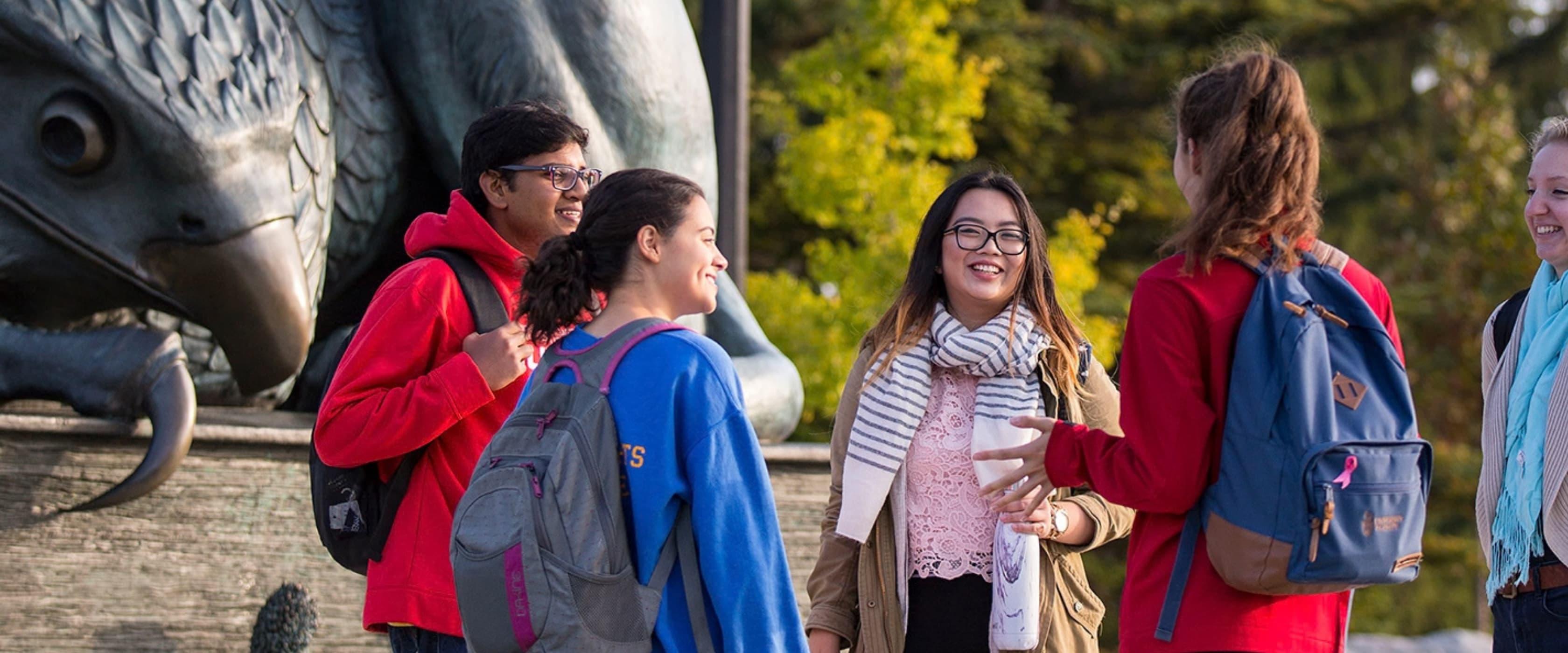 Students at the Gryphon Statue