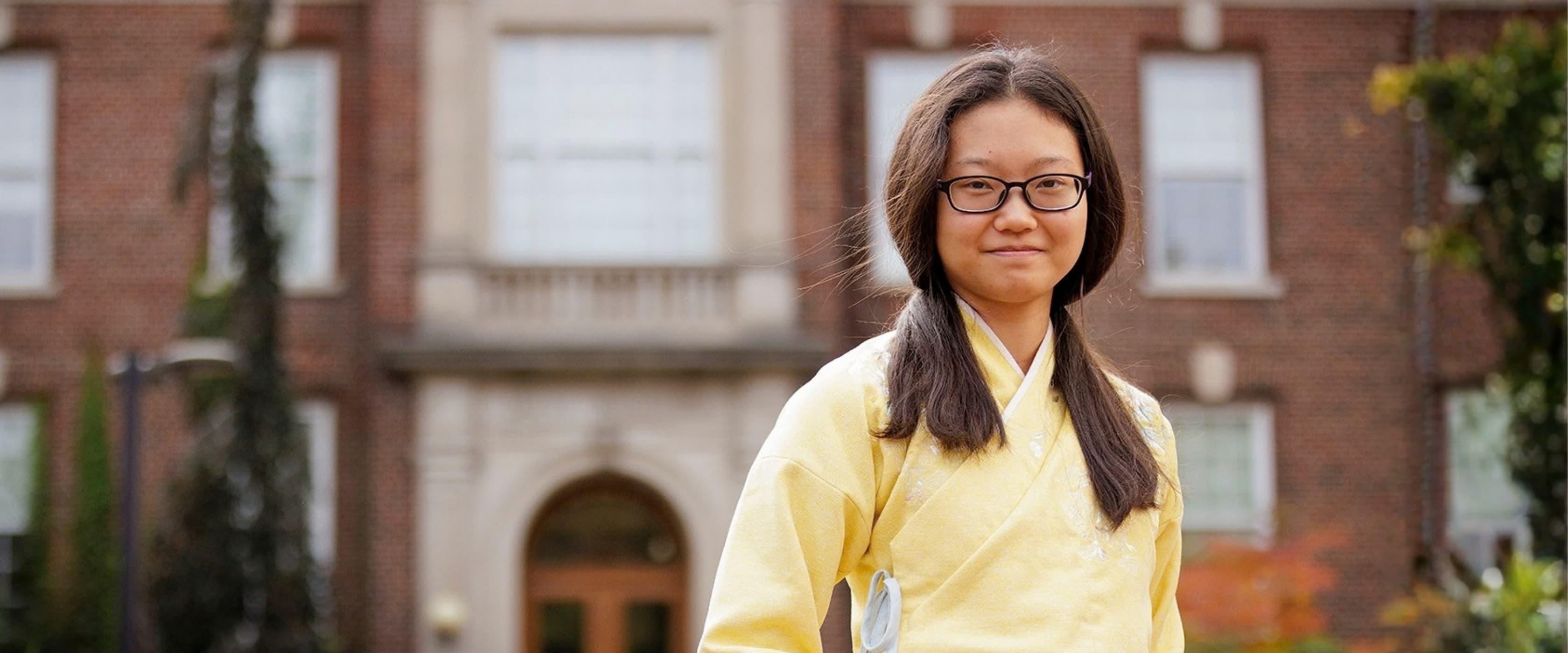 Student in front of Food Science building