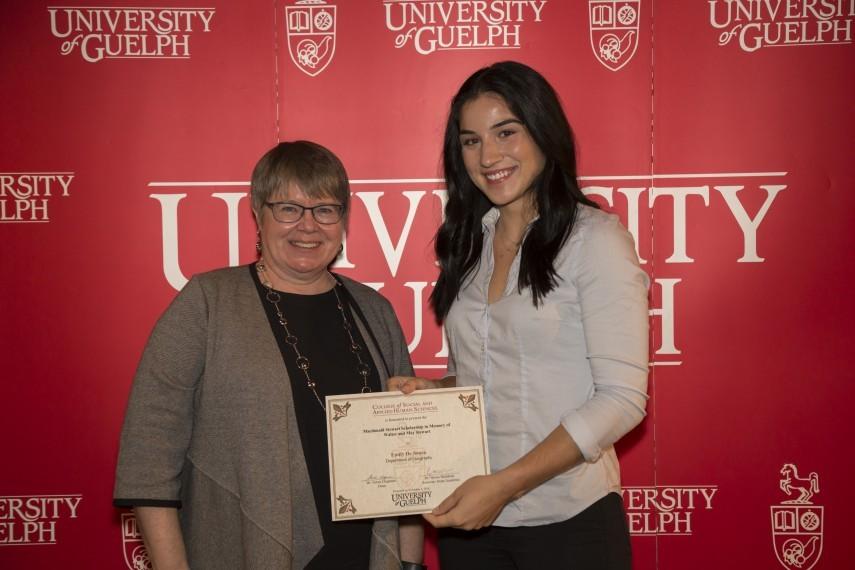 Emily De Sousa receiving the scholarship at College of Social and Applied Human Sciences award ceremony.