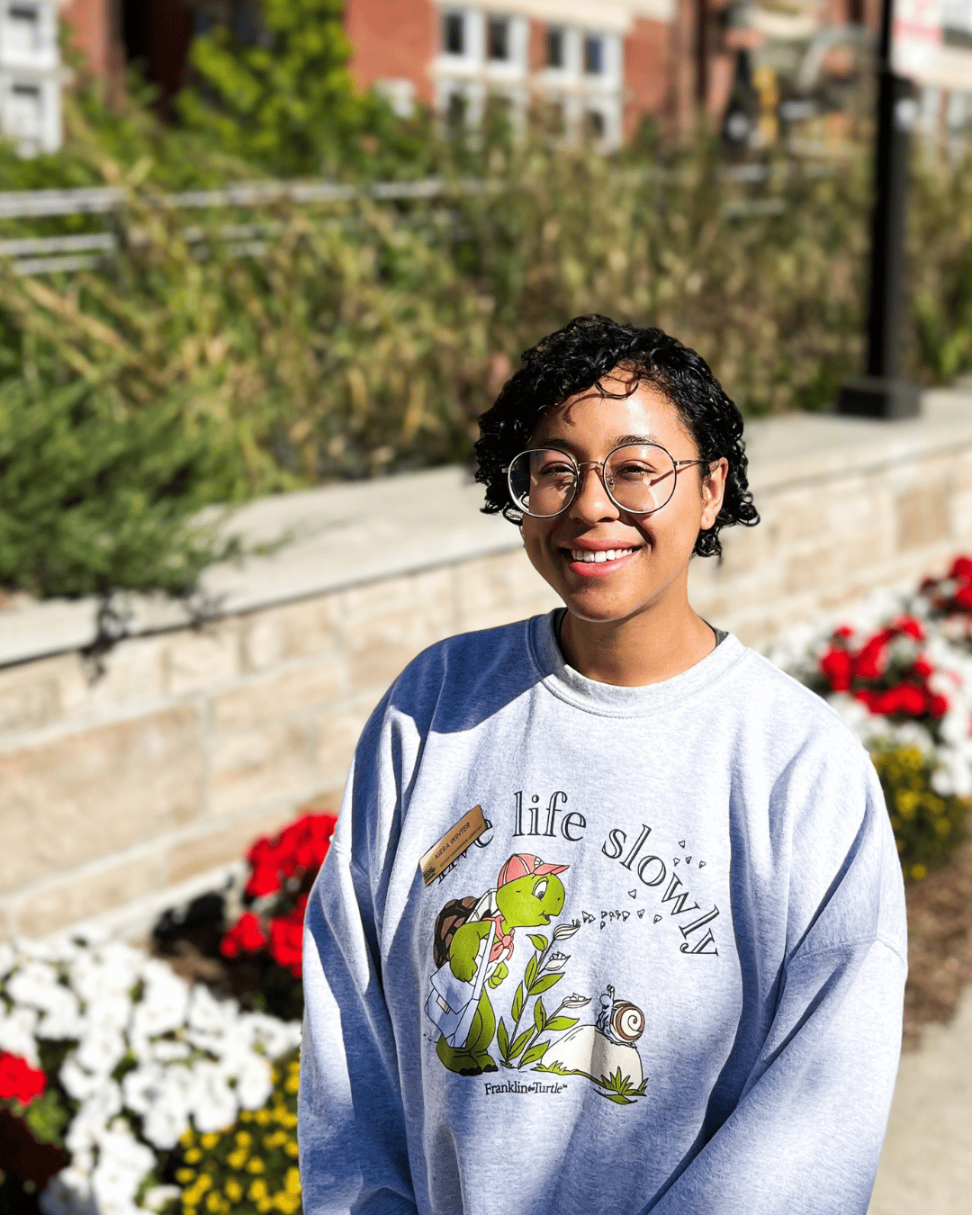A student smiling at the camera 