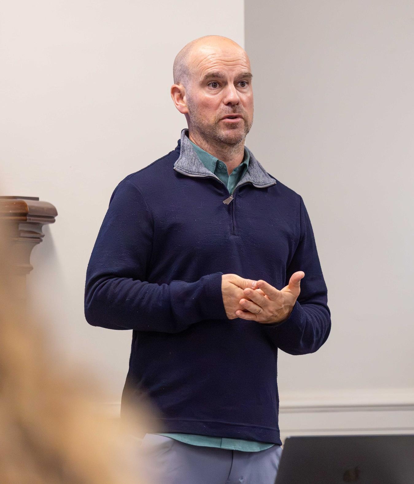 Leith Deacon teaching in a classroom