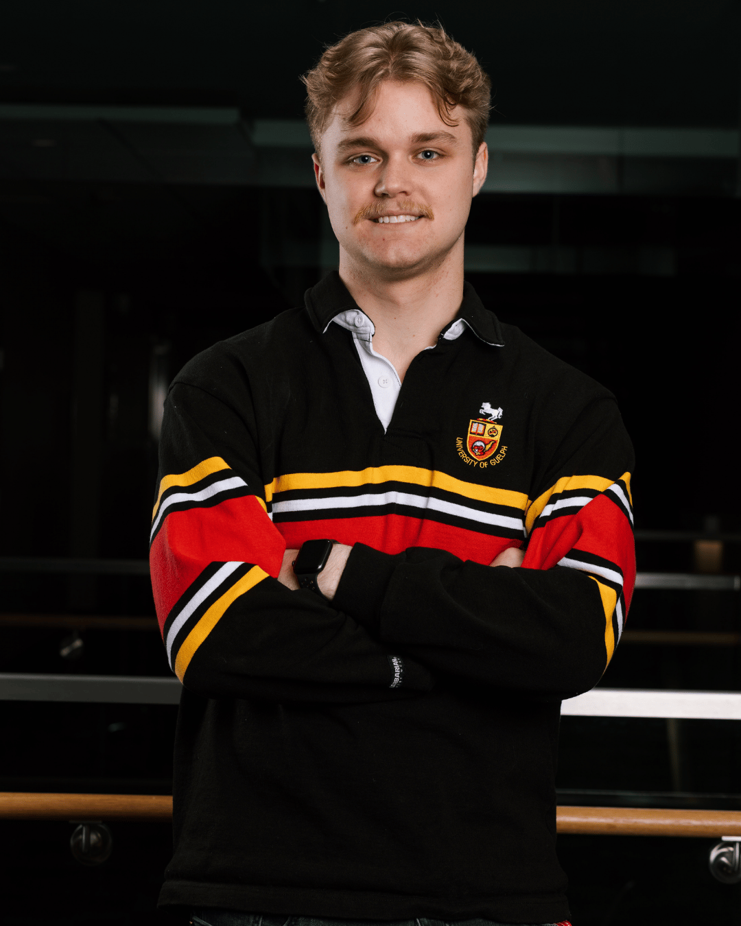A student smiling at the camera 