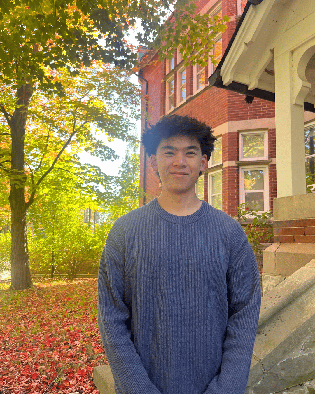 A student smiling at the camera 