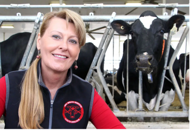 Dr. Bonnie Mallard is pictured in front of dairy cows