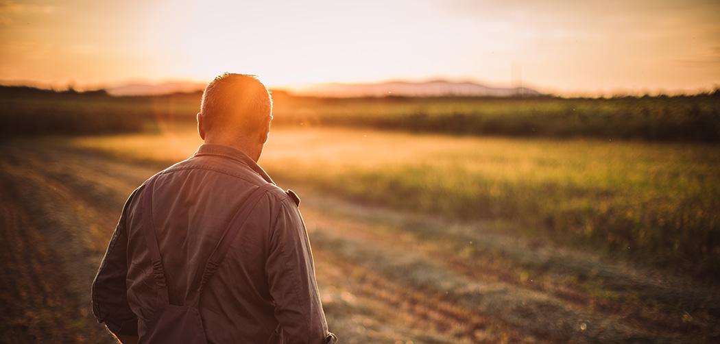 Farmer in a field (iStock credit_Hirurg)
