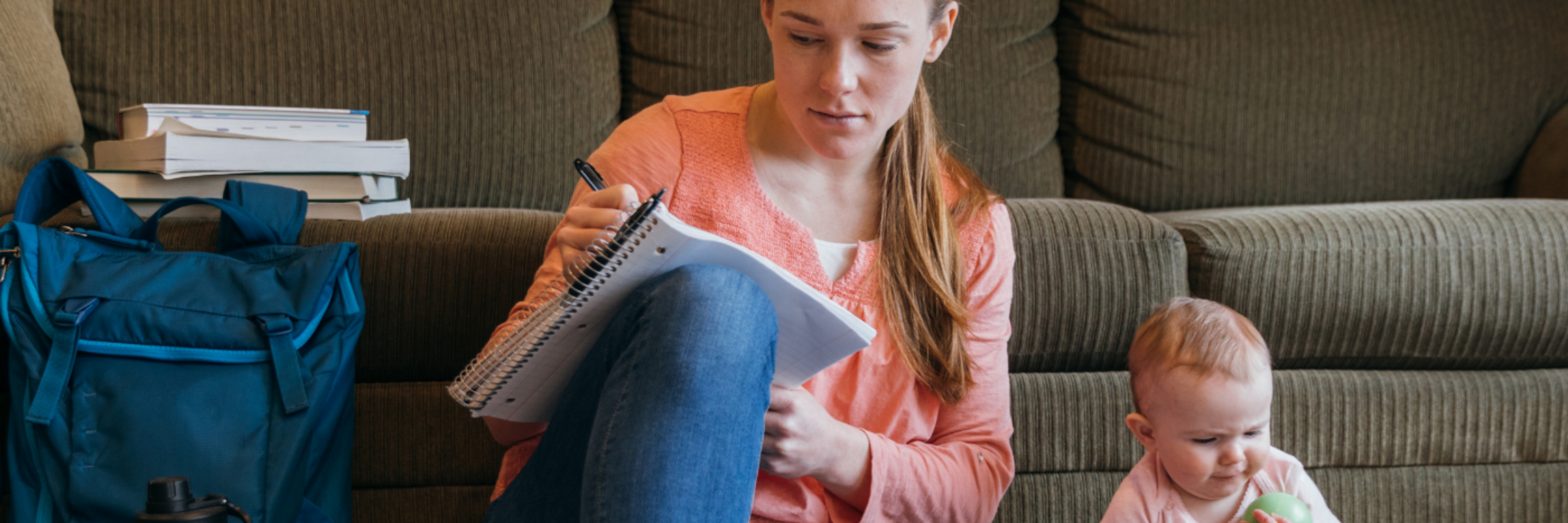 A student studying with their baby