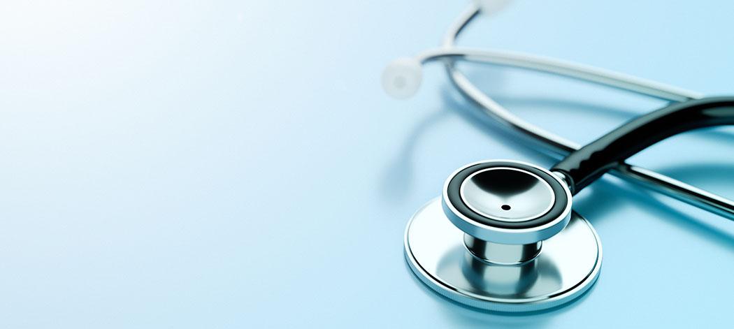 Stethoscope lying on a blue background (Stock-866772230_credit_mkurtbas)