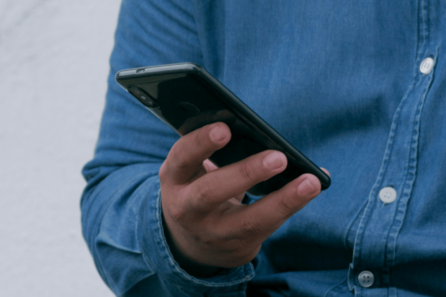 Person holding a phone in one hand.