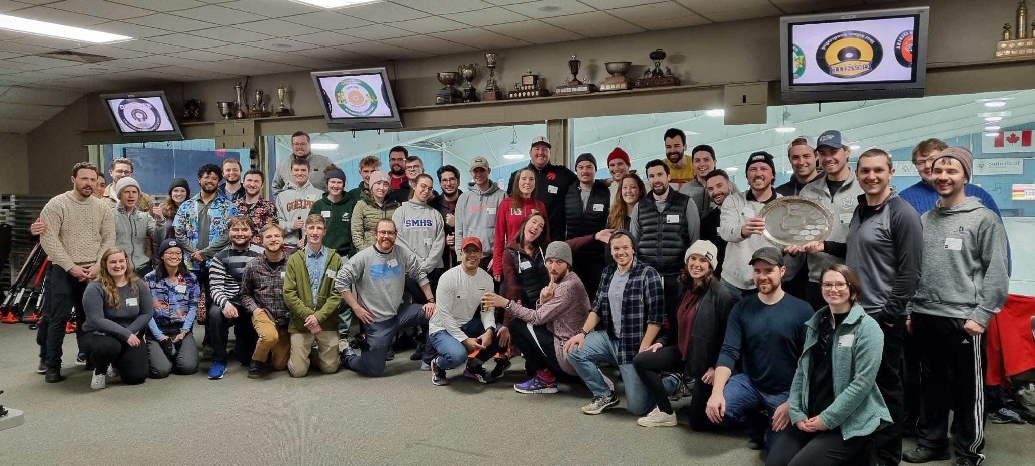 A group photo taken at a curling club