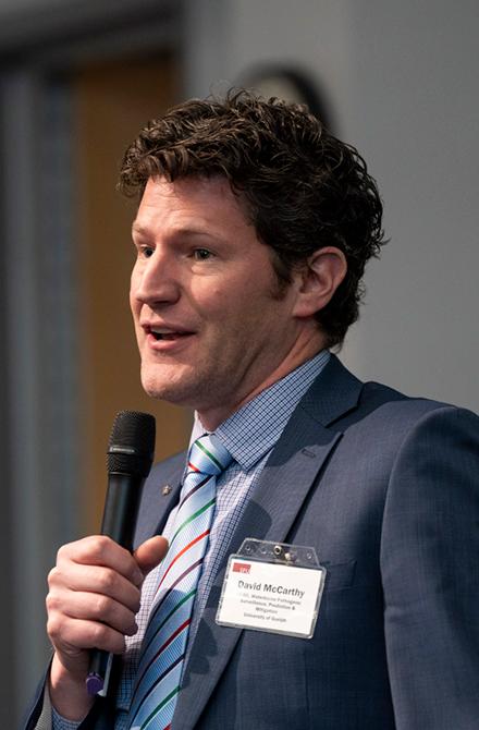 Dr. David McCarthy speaking at an event