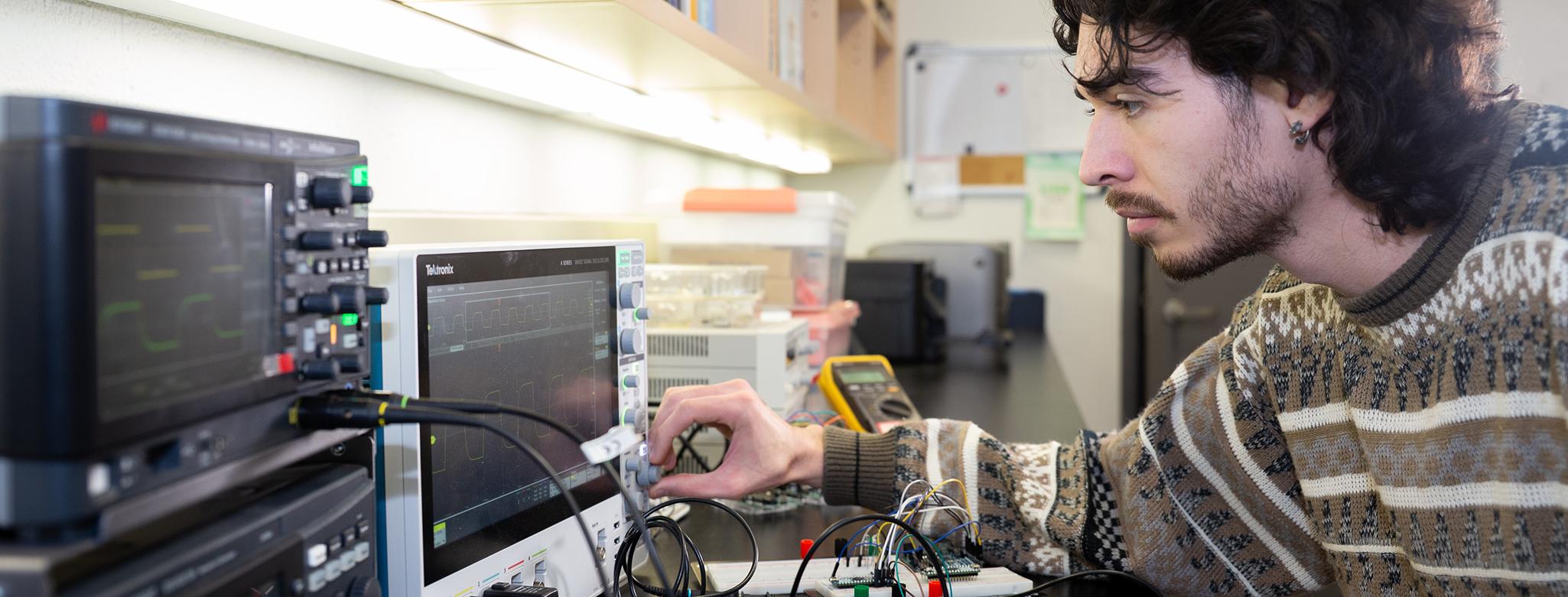A student working with electrical devices