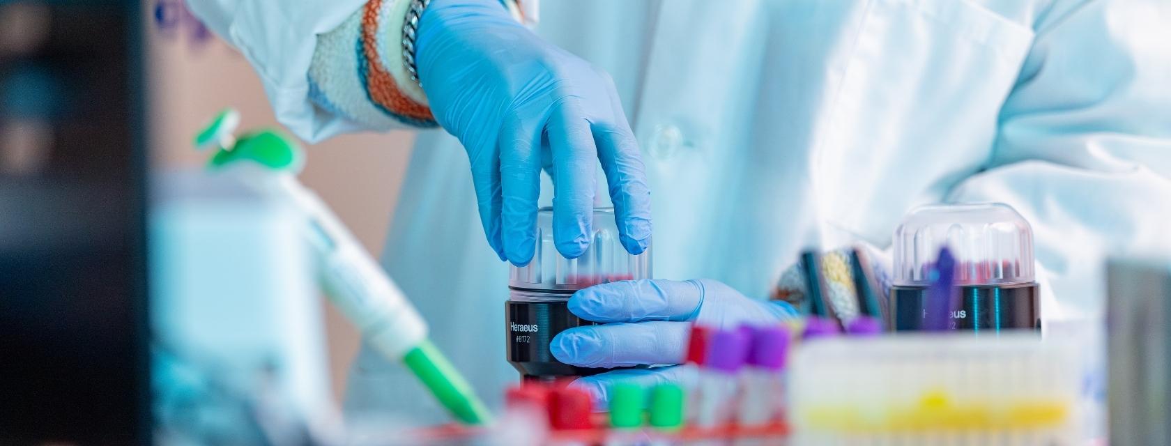 Researcher with test tubes in a lab