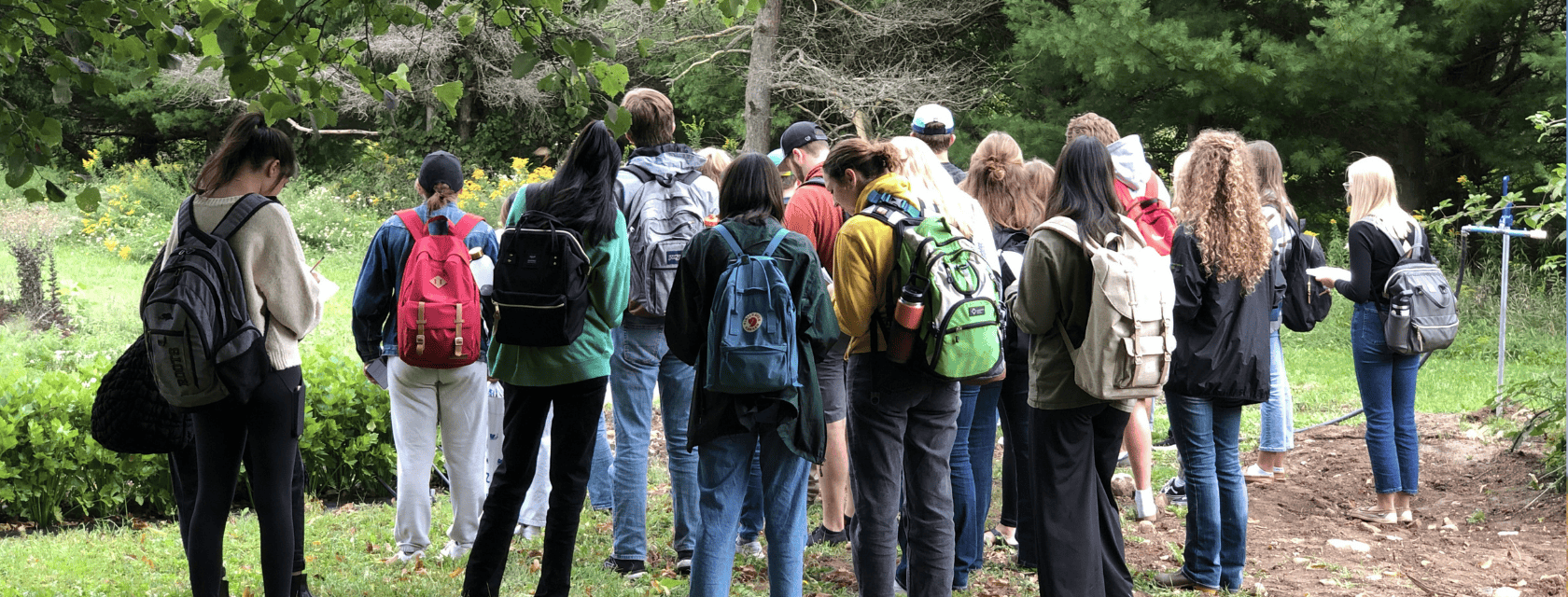 students touring the organic farm