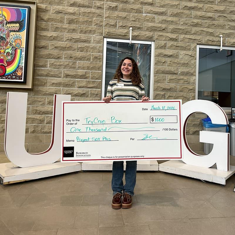 Kirsty Yates with her award cheque for the TryCrop Box submission.