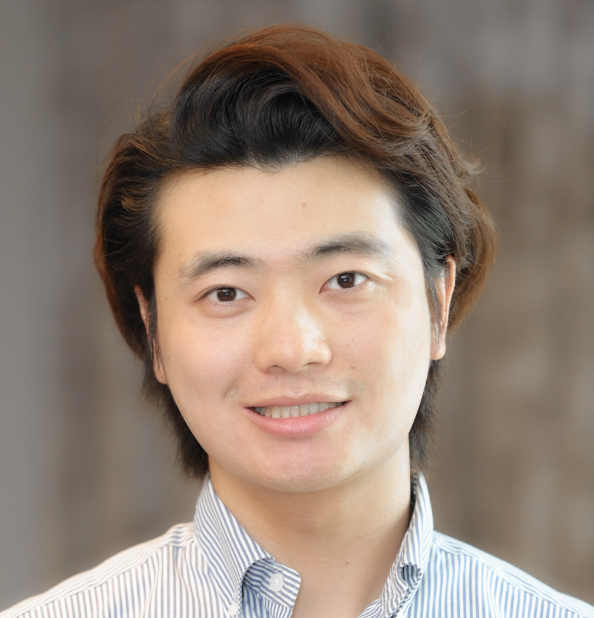 Dr. Wenjie Zhan in a striped button down shirt