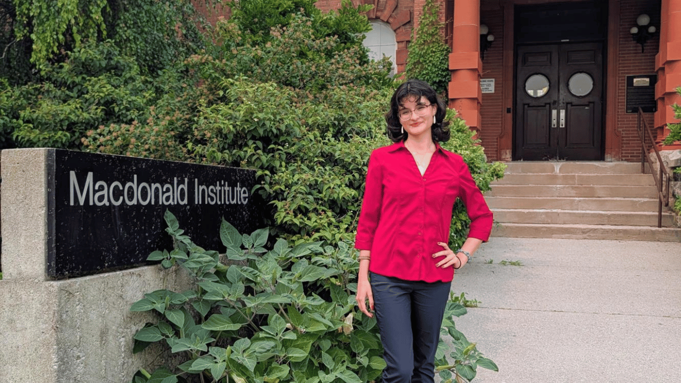 Sofia Esparza Esparza in front of the Macdonald Institute at the University of Guelph.