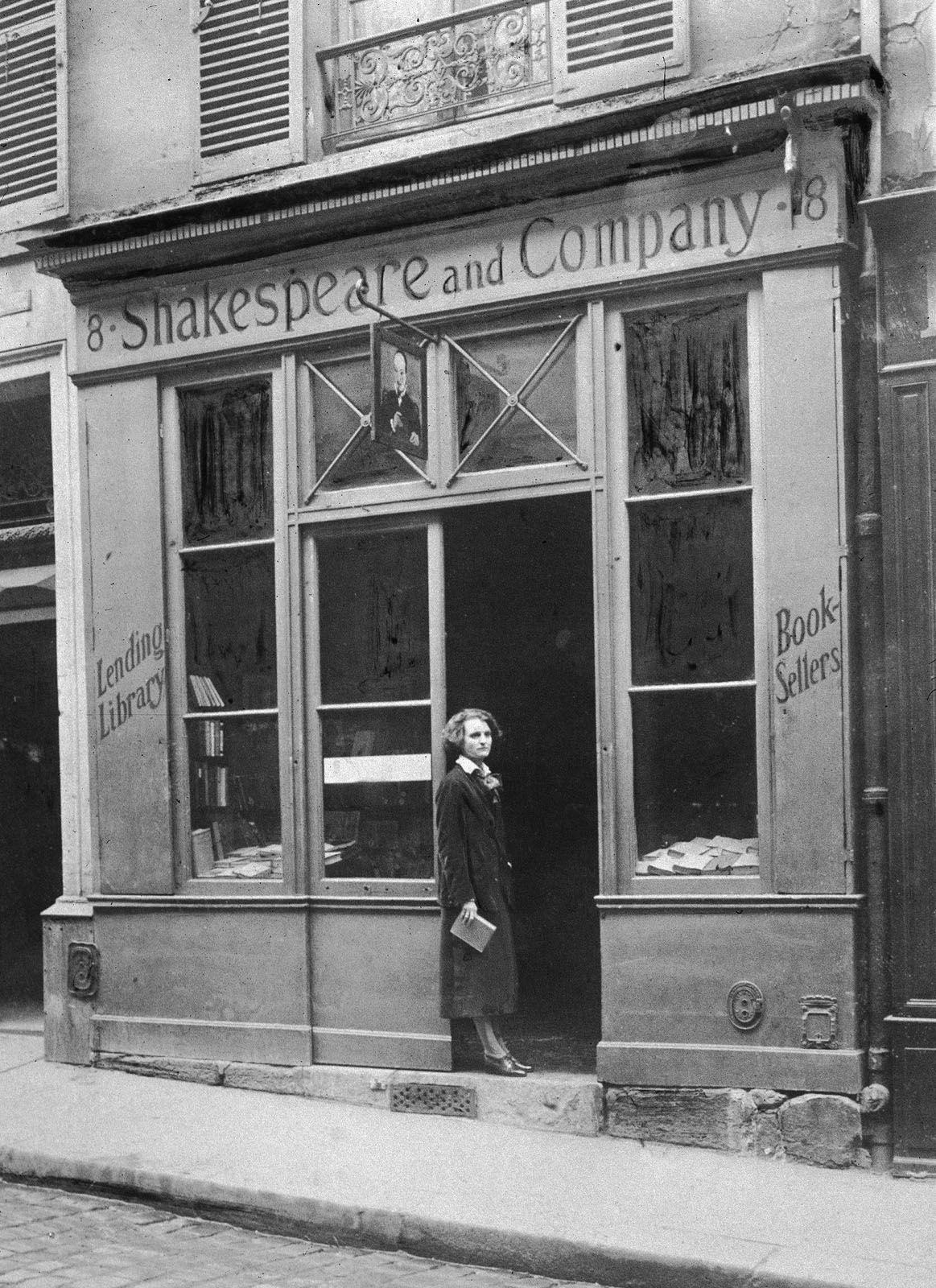 Sylvia Beach standing in front of her bookstore, Shakespeare and Company