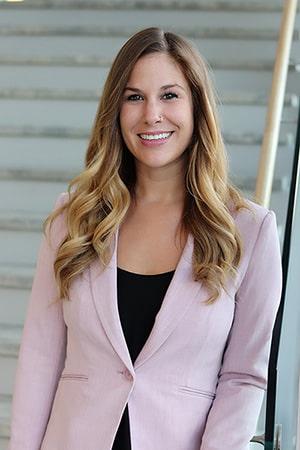 A woman with long hair looking at the camera