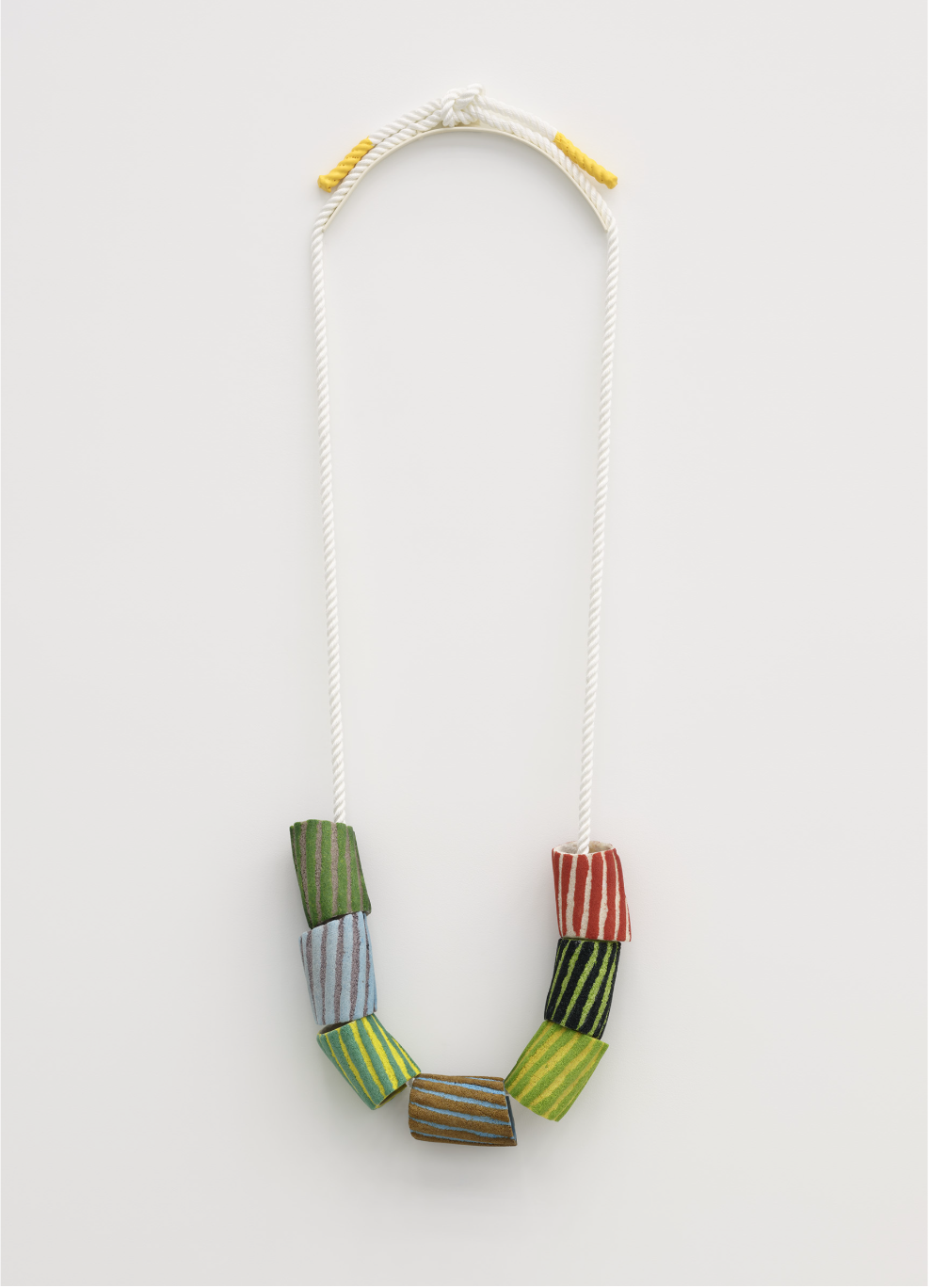Devon Knowles, Grains of Sand, 2024, glass frit, nylon rope, painted metal, rubber, 56 x 18 x 4 in. (142 x 45 x 10 cm). Image c/o Catriona Jeffries Gallery, image credit: Rachel Topham Photography
