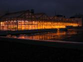 Exterior picture of greenhouse at night with all lights on