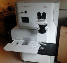 Image of a white Leica HPM100 ancillary machine prepared with aqueous specimens ready for freezing