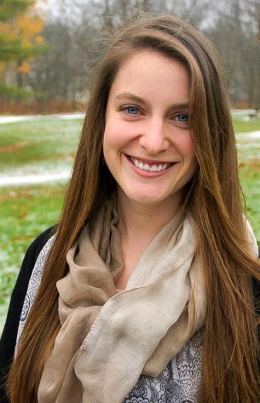 Photo of Emily Duncan with a field in the background.