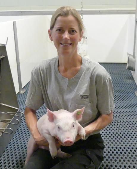 Terri O'sullivan holding a piglet