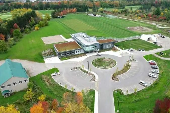 Aerial photo of the new G.M. Frost Research and Information Centre, a building with grass behind it and parking in the front.