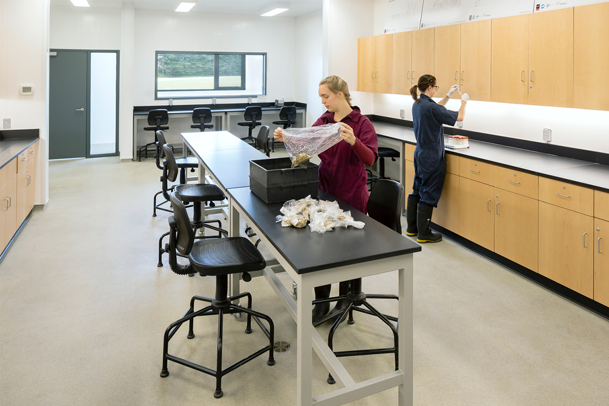 Two female students working in a lab