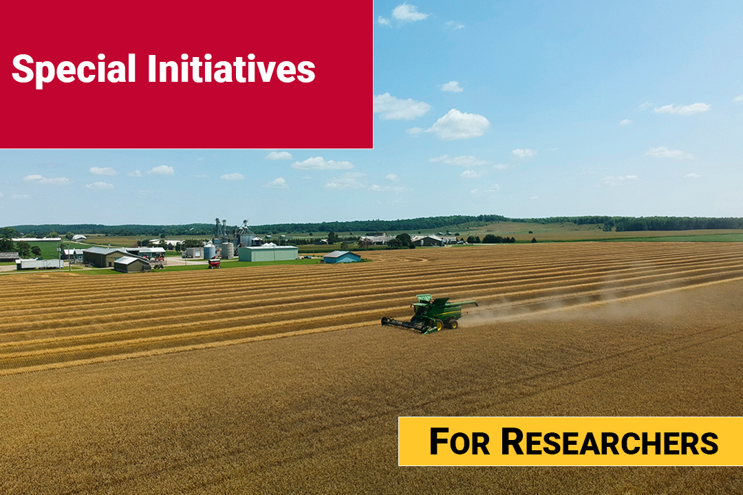 An aerial views of a tractor harvesting wheat in a field with a red text box in the top corner that says Special Initiatives.